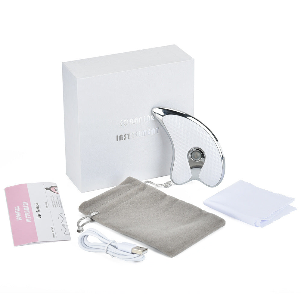 Rechargeable Vibrating Facial Massager Into the Scraping Board